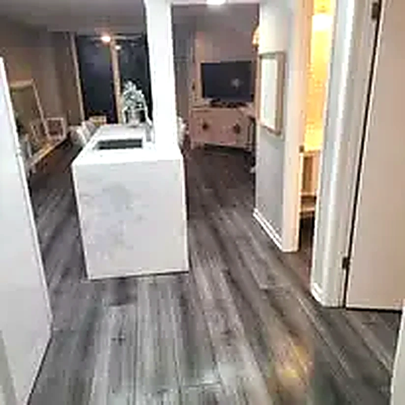 White waterfall quartz kitchen island installed during a full kitchen remodel